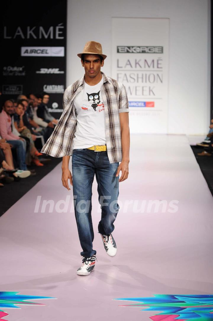 A model walks the runway at the Energie show at Lakme Fashion Week day 2 in Mumbai. .