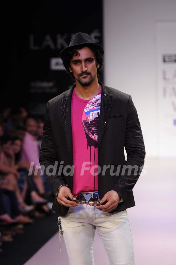 A model walks the runway at the Energie show at Lakme Fashion Week day 2 in Mumbai. .