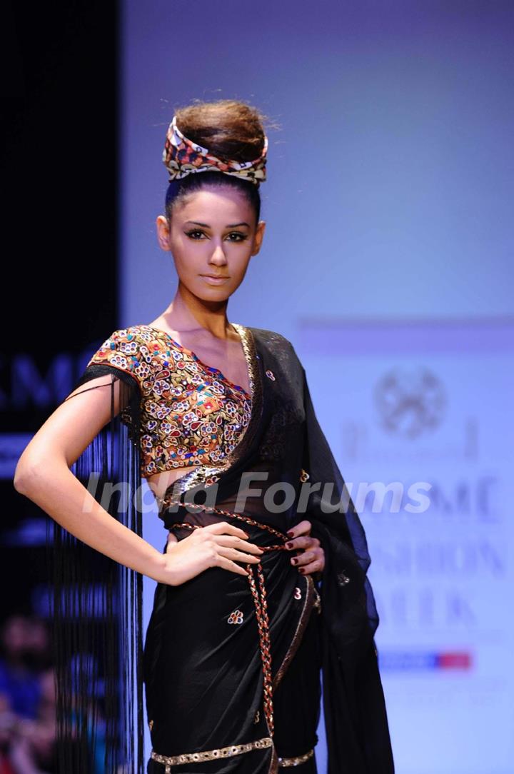 A model displays designer Priya Puri's creations during the Lakme Fashion Week day 4 in Mumbai. .