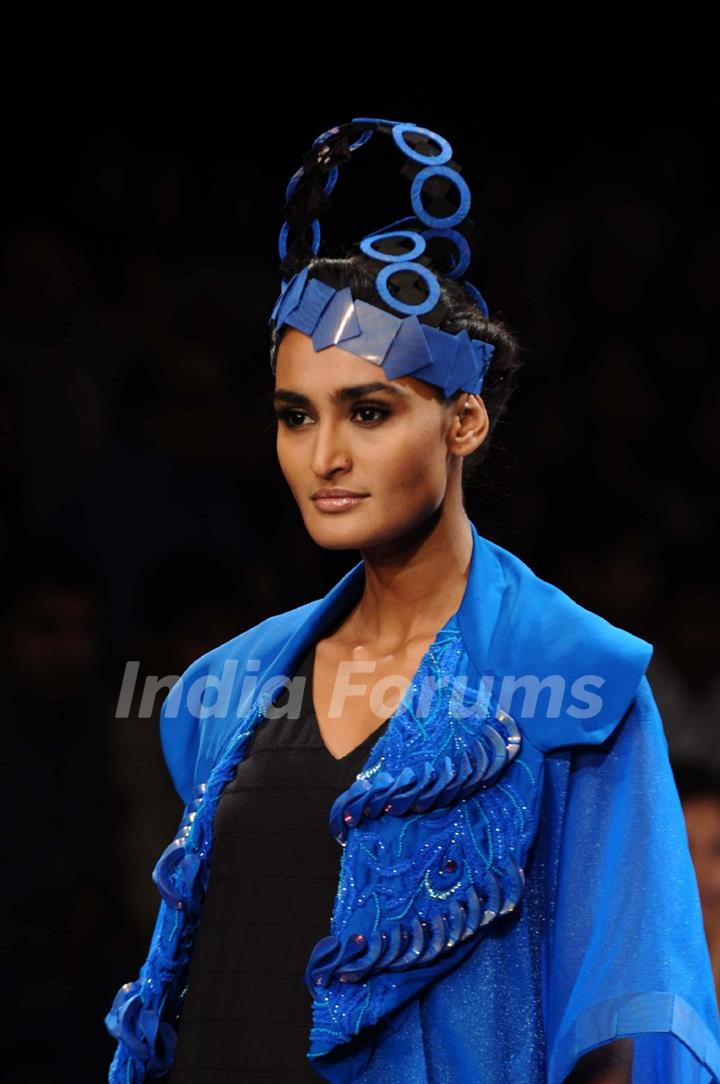 A model displays designer Harangad Singh's creations during the Lakme Fashion Week 2011 Day 5 in Grand Hyatt, Mumbai. .