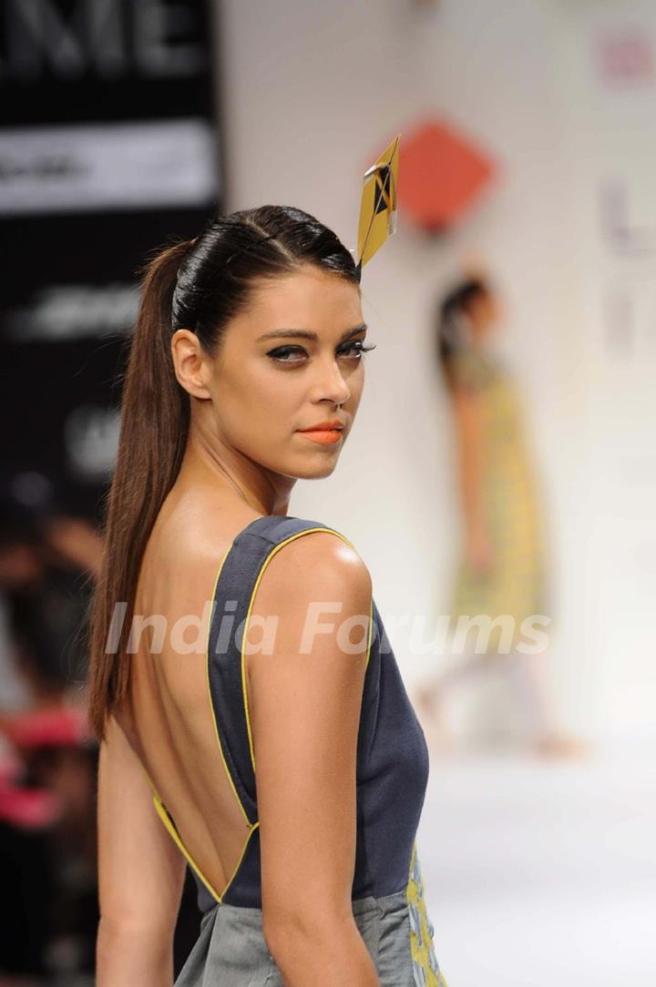 A model displays designer Abhishek Dutta's creations during the Lakme Fashion Week 2011 Day 5 in Grand Hyatt, Mumbai. .