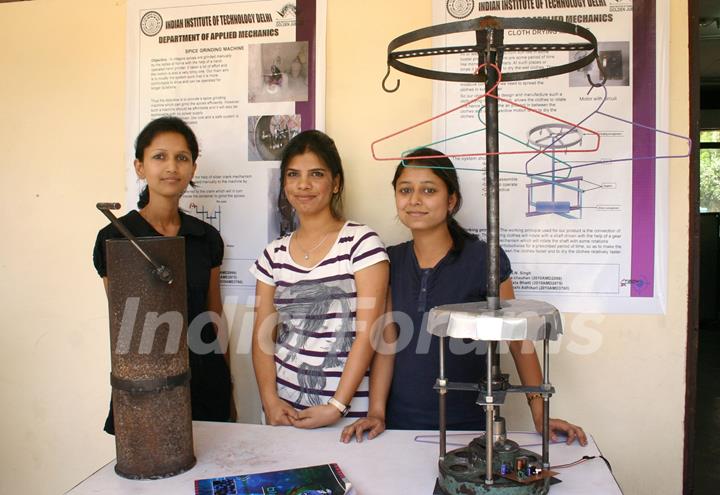 A IIT Delhi students with their innovated a Manual Spice Grinding Machine and a Cloth Drying Machine at the Open House 2011 in New Delhi on Saturday. .