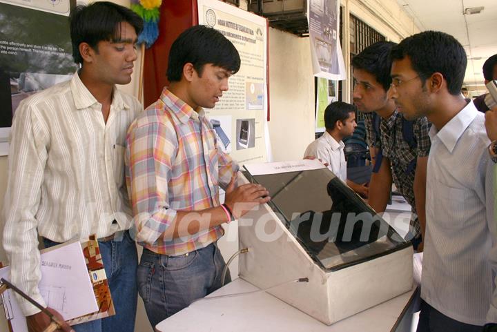 A IIT Delhi students with their innovated low cost Sea Water Purifier at the Open House 2011 in New Delhi on Saturday. .