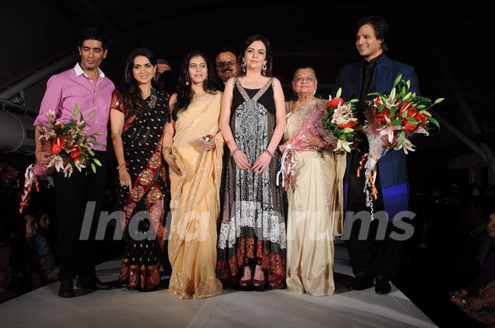 Nita Ambani, Kajol and Vivek Oberoi walk the ramp for Shaina NC and Manish Malhotra at the Pidilite-CPAA charity fashion show. .