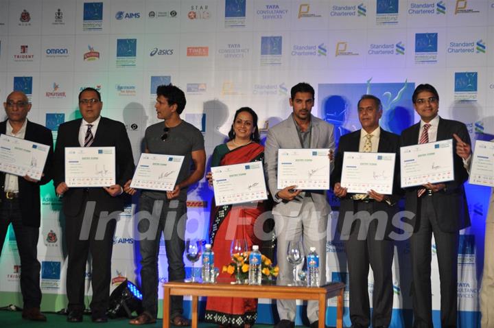 John and Milind during the launched of registrations for Mumbai Marathon 2012 categories of 9th Edition at Trident Hotel