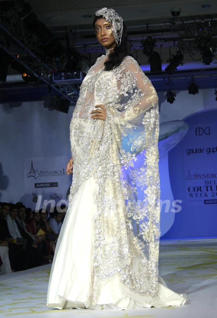 A model showcasing designer Gaurav Gupta's creation at the Synergy1 Delhi Couture Week,in New Delhi