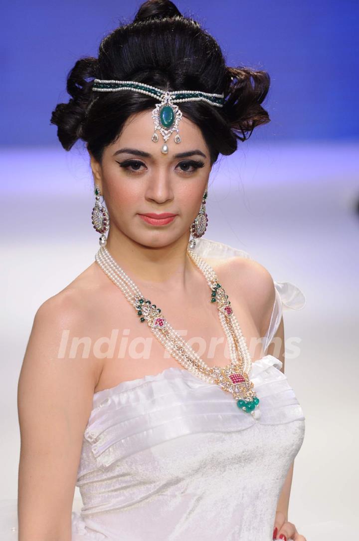 Models walks the ramp for Eekani at IIJW 2011