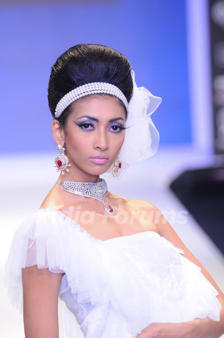 Models walks the ramp for Eekani at IIJW 2011