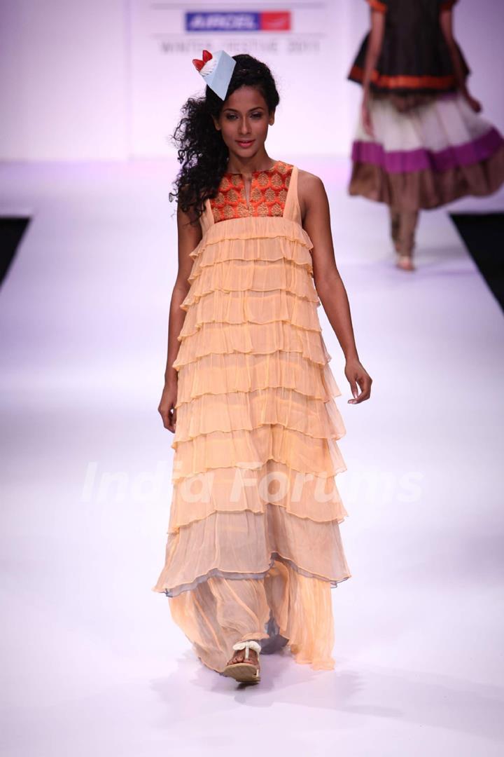 Model displays designer VJ Balhara's creation during the Lakme Fashion Week Day 3 in Mumbai. .