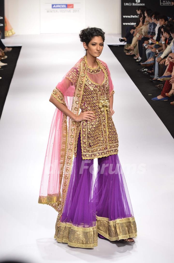 Model displays designer Preeti S. Kapoor's creation during the Lakme Fashion Week Day 5 in Mumbai. .