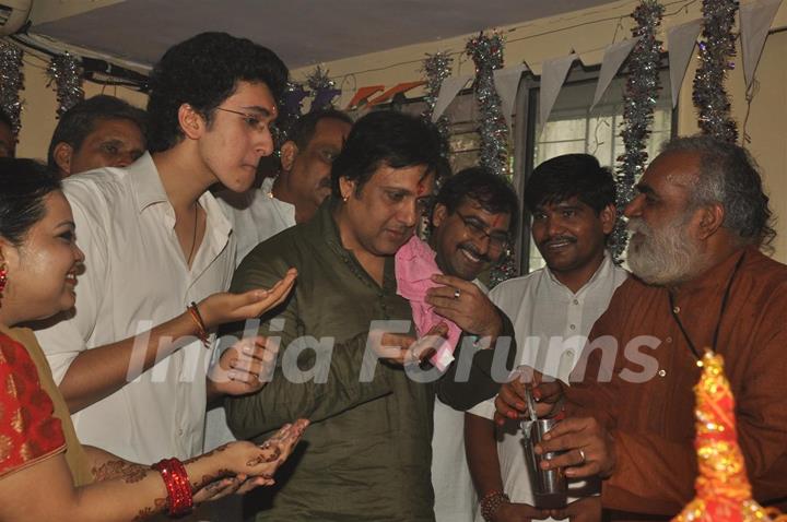 Govinda paying devote to Lord Ganesha during the occasion of Ganesh Chaturthi at their home