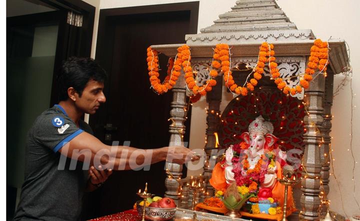 Sonu Sood paying devote to Lord Ganesha during the occasion of Ganesh Chaturthi at their home