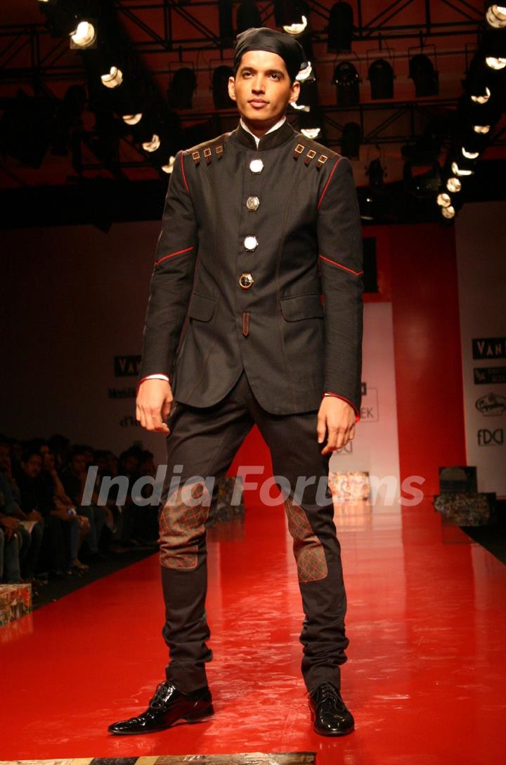 A model showcasing designer Arjun Khanna's creation at the Ven Heusen India Mens Week 2011, in New Delhi on Friday. .
