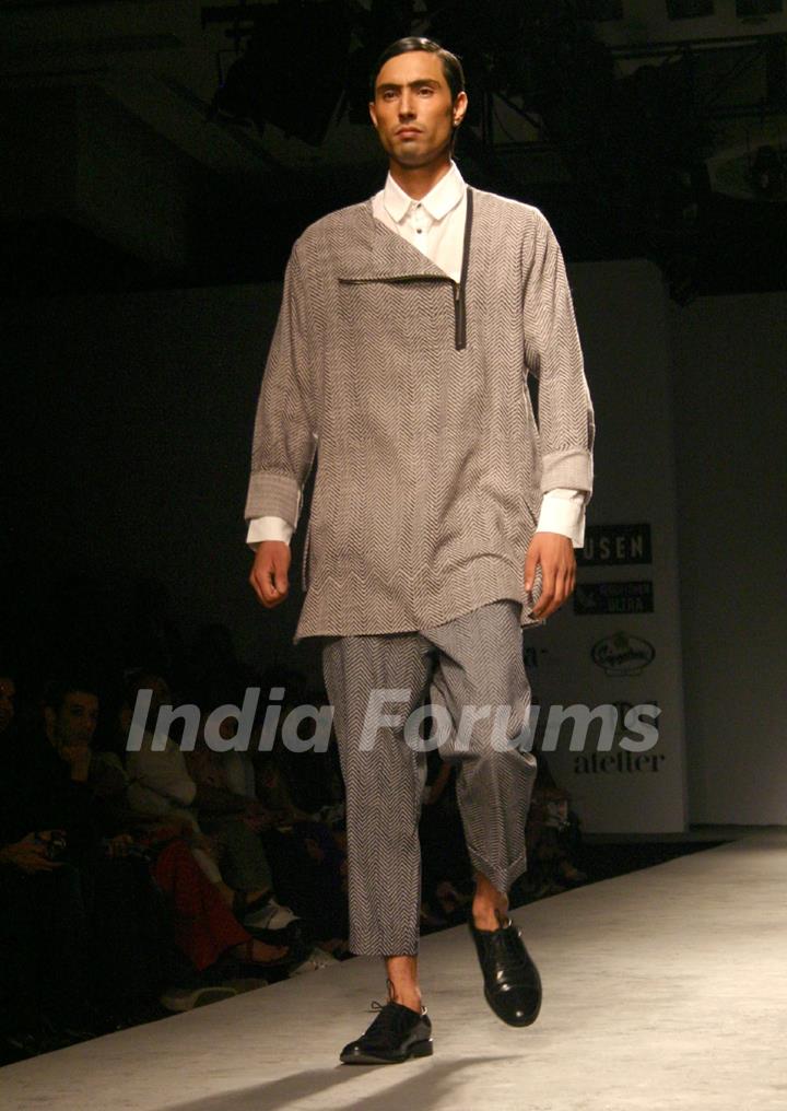 A model showcasing designers Abraham & Thakore's creation at the Van Heusen India Mens Week 2011, in New Delhi on Saturday. .
