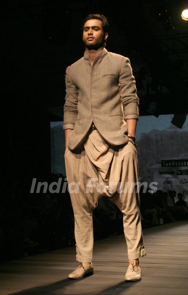 A model showcasing designer Tarun Tahiliani's creation at the Ven Heusen India Mens Week 2011, in New Delhi on Friday. .