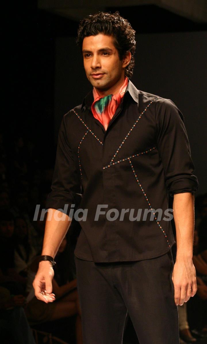 A model showcasing designer Manoviraj Khosla,s creation at the Van Heusen India Fashion Week,in New Delhi. .