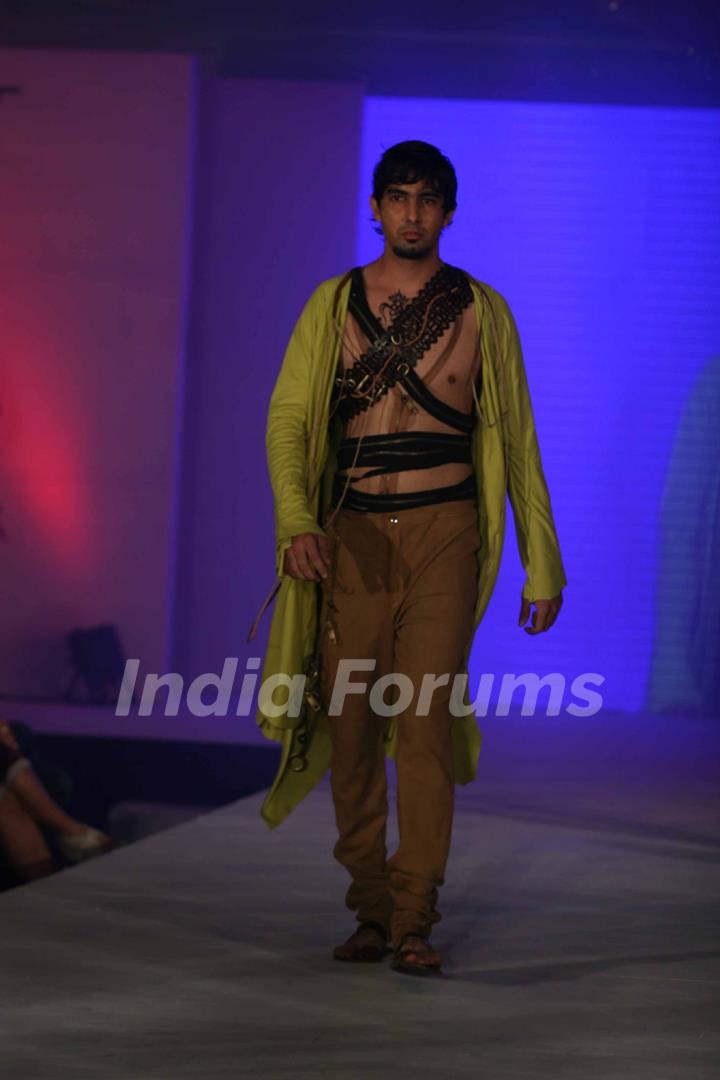 Model walks the ramp for WLC Chimera fashion show at Leela Hotel