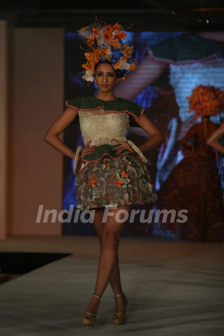 Model walks the ramp for WLC Chimera fashion show at Leela Hotel