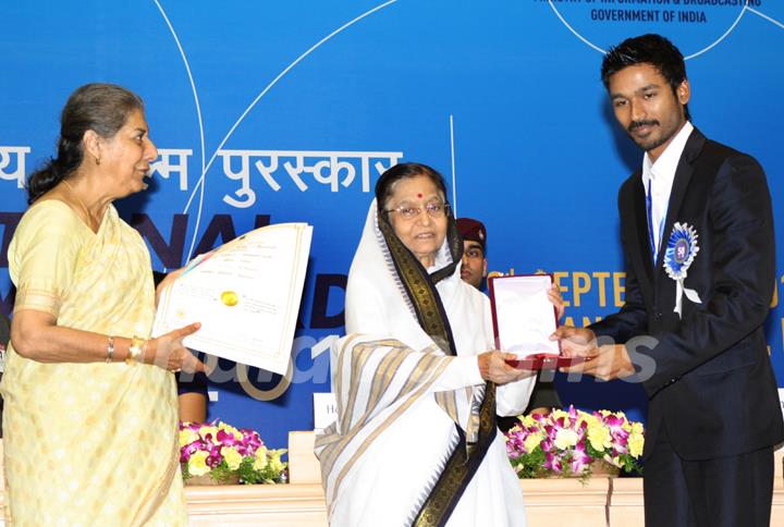 President Pratibha Devisingh Patil and Union Minister Ambika Soni  presenting the ''Best Actor Award'' to K. Dhanush at the 58 th National Film Awards 2010, in New Delhi. .