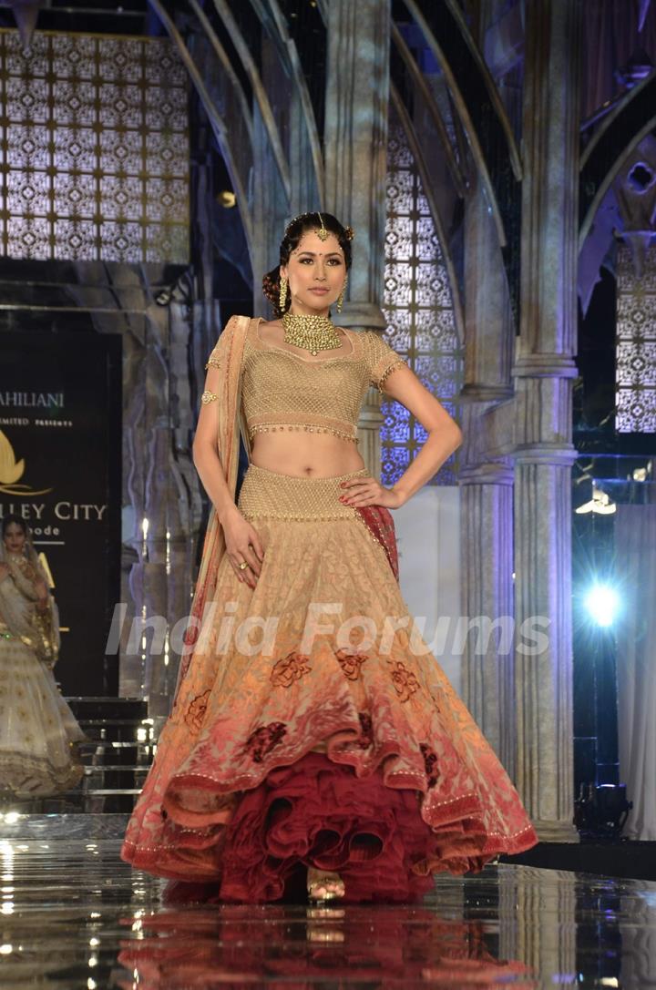 Model walks the ramp for Tarun Tahiliani show at Aamby Valley Fashion week. .