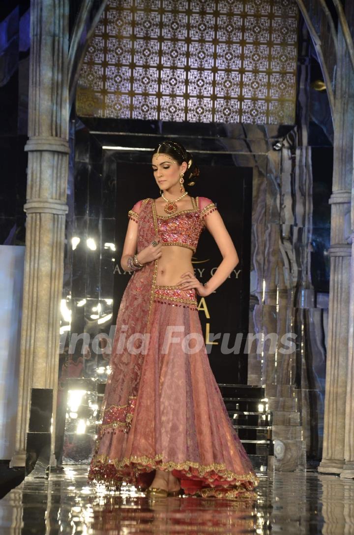 Model walks the ramp for Tarun Tahiliani show at Aamby Valley Fashion week. .