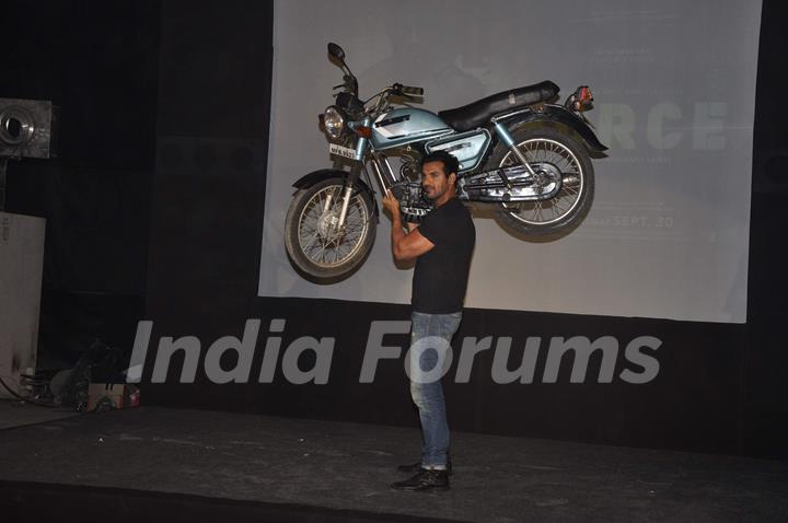 John Abraham lifts a bike at Force promotions in Mehboob, Mumbai