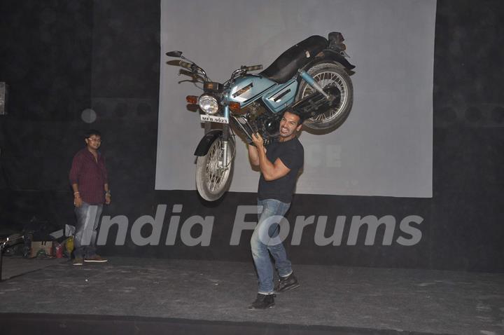 John Abraham lifts a bike at Force promotions in Mehboob, Mumbai