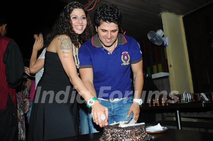 Bakhtiyaar Irani cutting Cake with wife Tanaaz Irani