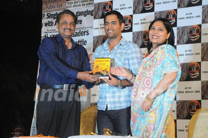 Mahendra Singh Dhoni with Y.P Singh and Abha Singh at launch of novel 'Carnage by Angels'