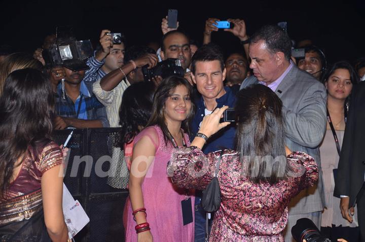 Hollywood actors Tom Cruise poses for a photo before a special screening of their upcoming film Mission Impossible at IMAX Wadala. .