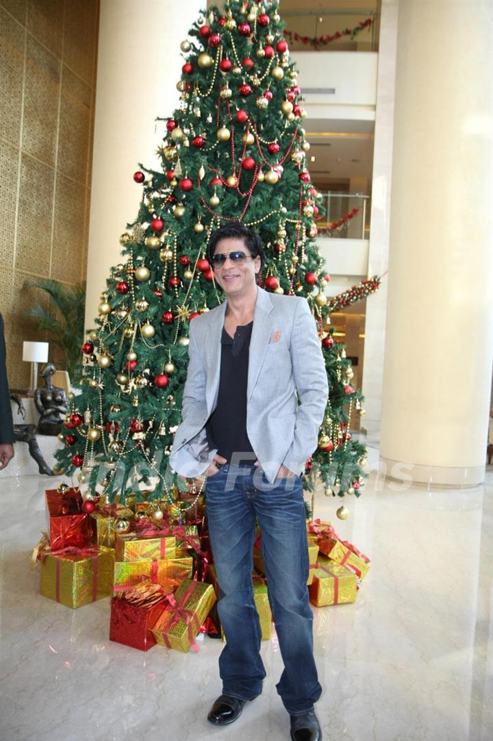 Shah Rukh Khan posing with a Christmas Tree in a Christmas Special photo shoot at Hotel Trident