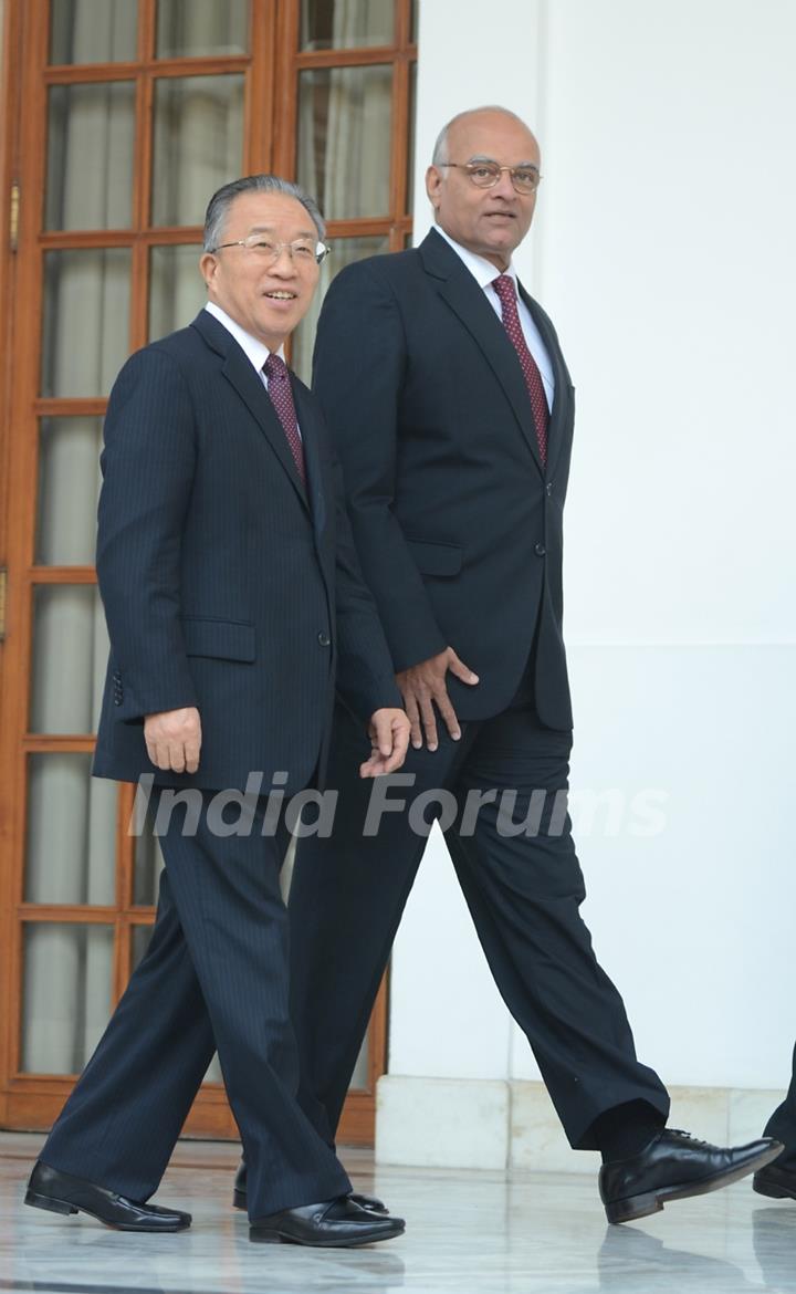 Chinese State Councilor Dai Bingguo, left, arrives to pose along with Indian National Security Adviser Shivshankar Menon in between the 15th Round of India-China Special Representatives Talks at Hyderabad House in New Delhi, India, Monday, Jan. ...