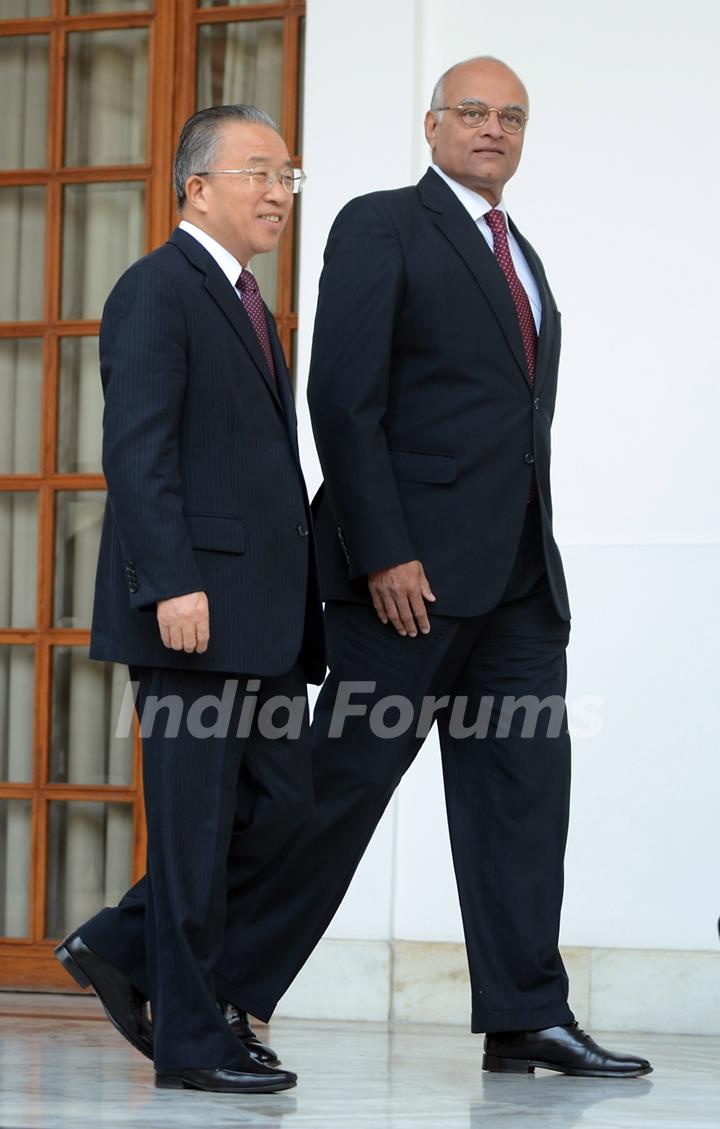 Chinese State Councilor Dai Bingguo, left, arrives to pose along with Indian National Security Adviser Shivshankar Menon in between the 15th Round of India-China Special Representatives Talks at Hyderabad House in New Delhi, India, Monday, Jan. ...