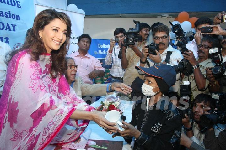 Madhuri Dixit Nene interacts with Cancer affected little patients on World Cancer Day organised by Pawan Hans at Juhu, Mumbai