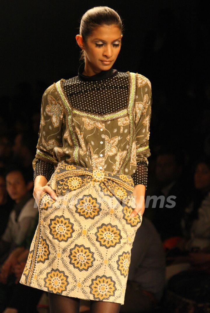A model displays a creation by designer Vineet Bhal at the Wills Lifestyle India Fashion week 2012,in New Delhi on Wednesday. .