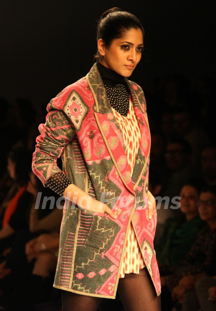 A model displays a creation by designer Vineet Bhal at the Wills Lifestyle India Fashion week 2012,in New Delhi on Wednesday. .