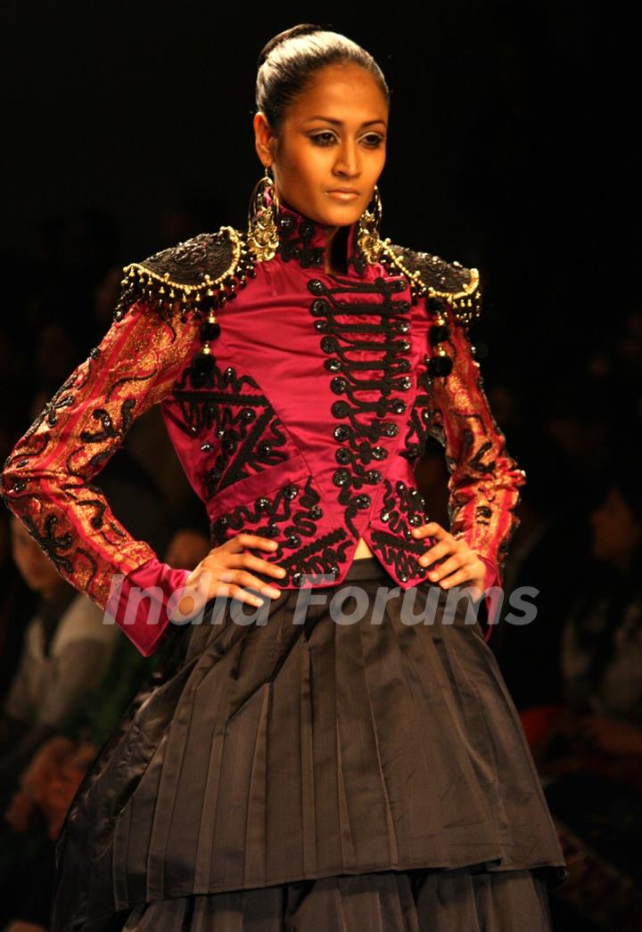 A model displays a creation by designer Preeti Chandra at the Wills Lifestyle India Fashion week 2012,in New Delhi on Wednesday. .