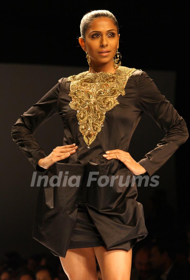 A model displays a creation by designer Preeti Chandra at the Wills Lifestyle India Fashion week 2012,in New Delhi on Wednesday. .