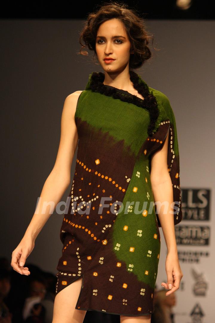 A model displays a creation by designer James Ferreira at the Wills Lifestyle India Fashion week 2012,in New Delhi on Wednesday. .