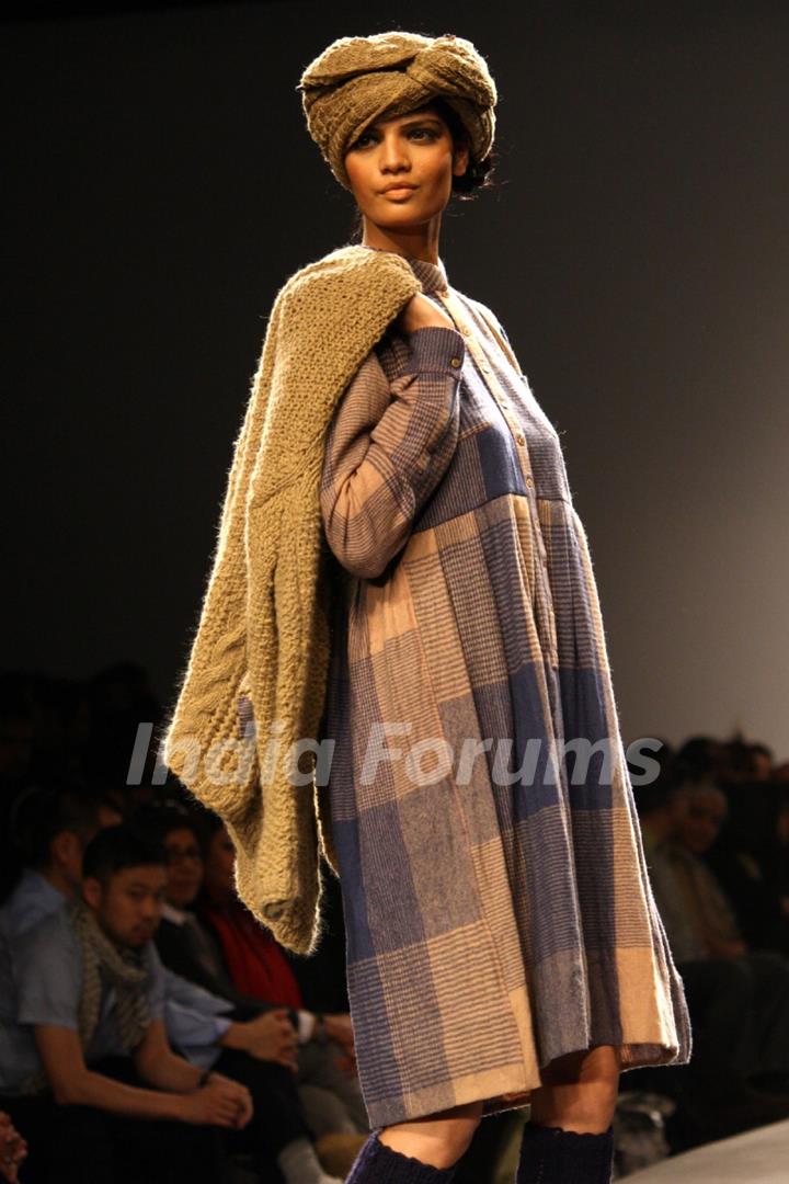 A model displays a creation by designer Aneeth Arora at the Wills Lifestyle India Fashion week 2012,in New Delhi.  .