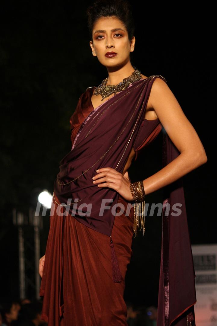 A model displays a creation by designer Tarun Tahiliani at the Wills Lifestyle India Fashion week 2012,in New Delhi on Thursday. .