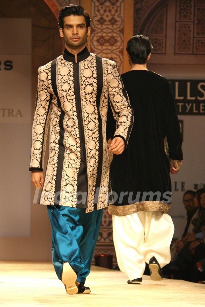 A model displays a creation by designer Manish Malhotra at the Wills Lifestyle India Fashion week 2012,in New Delhi on Friday. .