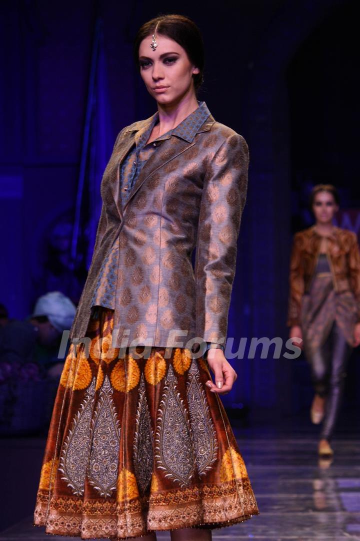 A model displays a creation by designer JJ Valaya at the Grand Finale of Wills Lifestyle India Fashion week 2012,in New Delhi on Sunday. .