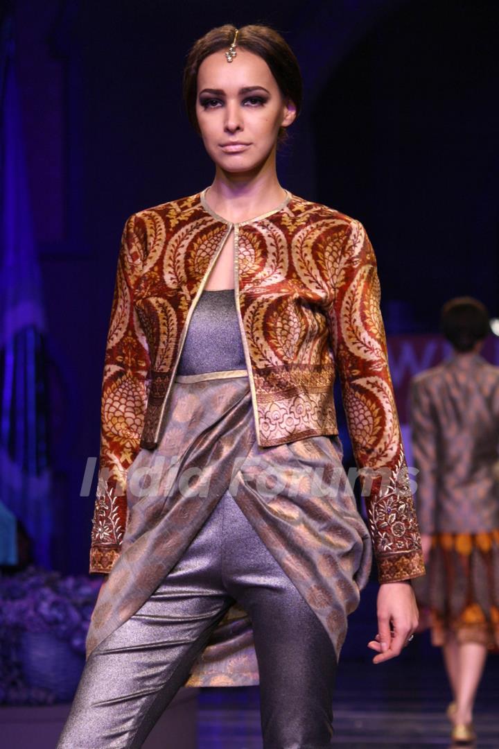 A model displays a creation by designer JJ Valaya at the Grand Finale of Wills Lifestyle India Fashion week 2012,in New Delhi on Sunday. .