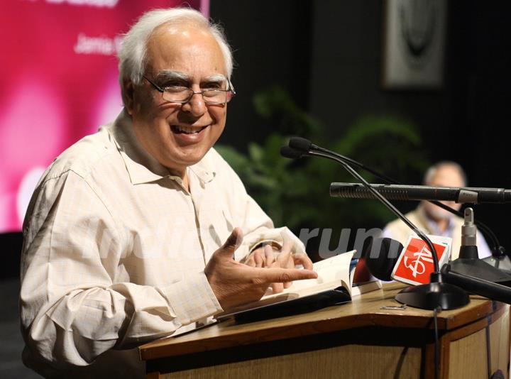 A poet and Union Minister Kapil Sibal reading a his poem at Jamia Millia Islamia University,in New Delhi on Tuesday. .