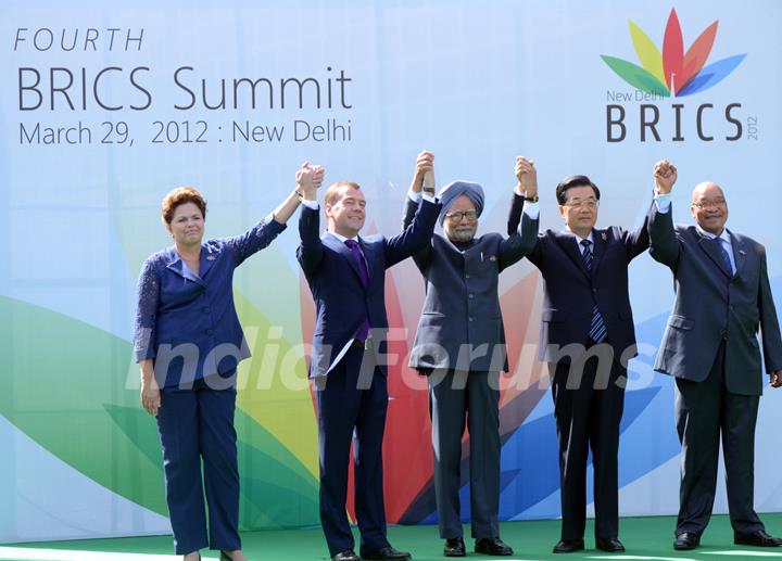 Brazil's President Dilma Rousseff, Russian President Dmitry Medvedev, India's Prime Minister Manmohan Singh, Chinese President Hu Jintao and South Africa's President Jacob Zuma (L to R) pose for group photos in New Delhi, capital of India, on ...