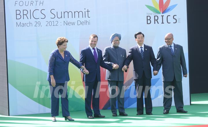 Brazil's President Dilma Rousseff, Russian President Dmitry Medvedev, India's Prime Minister Manmohan Singh, Chinese President Hu Jintao and South Africa's President Jacob Zuma (L to R) pose for group photos in New Delhi, capital of India, on ...