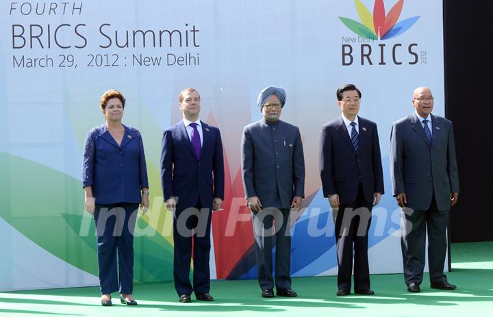 Brazil's President Dilma Rousseff, Russian President Dmitry Medvedev, India's Prime Minister Manmohan Singh, Chinese President Hu Jintao and South Africa's President Jacob Zuma (L to R) pose for group photos in New Delhi, capital of India, on ...