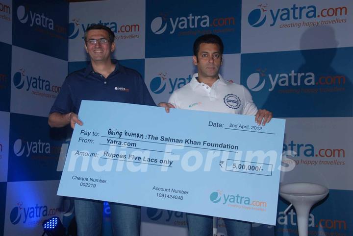 Yatra.com CEO, Mr Dhruv Shringi, presented a token amount of Rs. 5 Lakh to Salman for Being Human at Yatra.com new brand campaign launch press conference in Mumbai. .