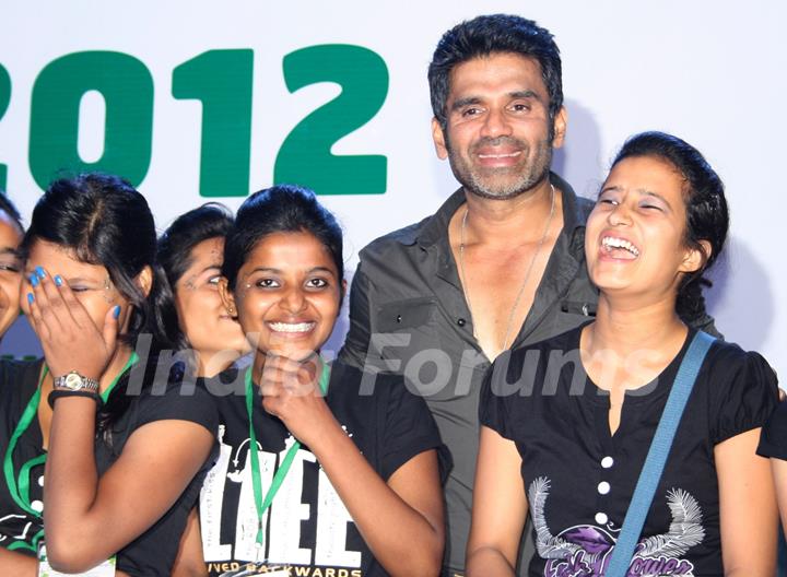 Bollywood actor Sunil Shetty with underprivileged children at the ChildFun day organized by ChildFund India, in New Delhi on Wednesday. .